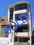 Three unit apartment building for sale